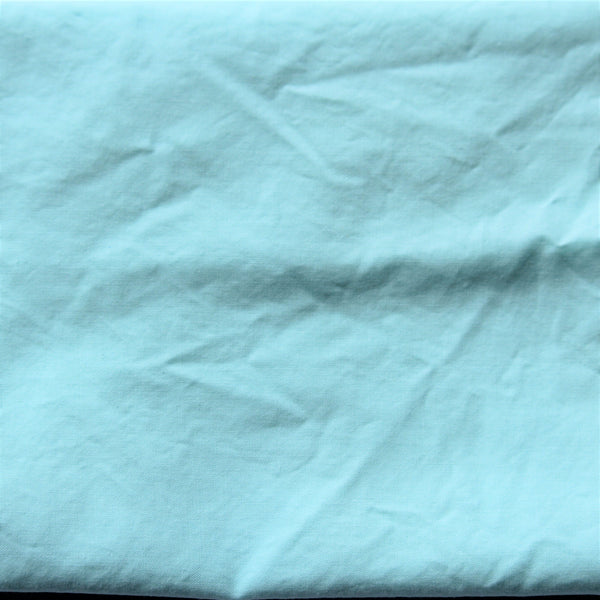 Close up of a piece of aqua coloured fabric