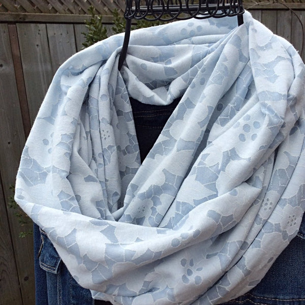 pale blue infinity scarf with floral burnout effect worn with jean jacket
