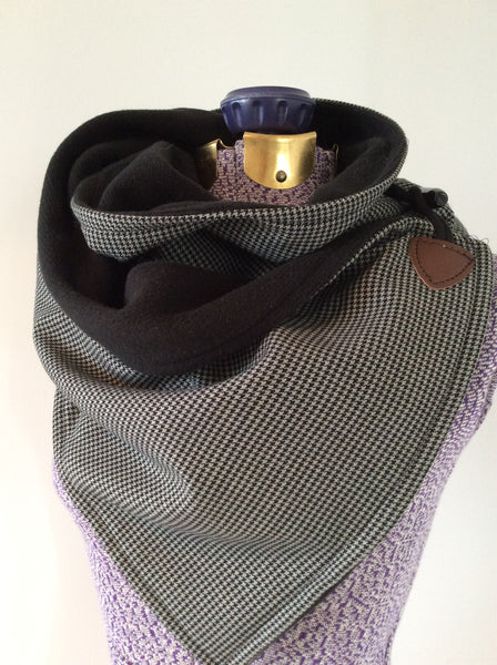 men's grey and black houndstooth and fleece neck wrap on mannequin