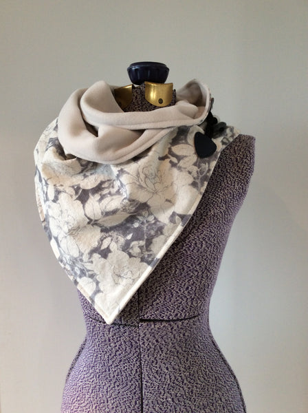 neck wrap in linen floral in ivory and grey with microfleece lining and a toggle fastener