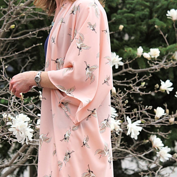 Light pink kimono cardigan with flying cranes side view